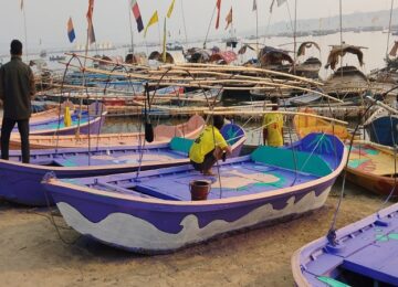 Painting being done on the boats of Sangam