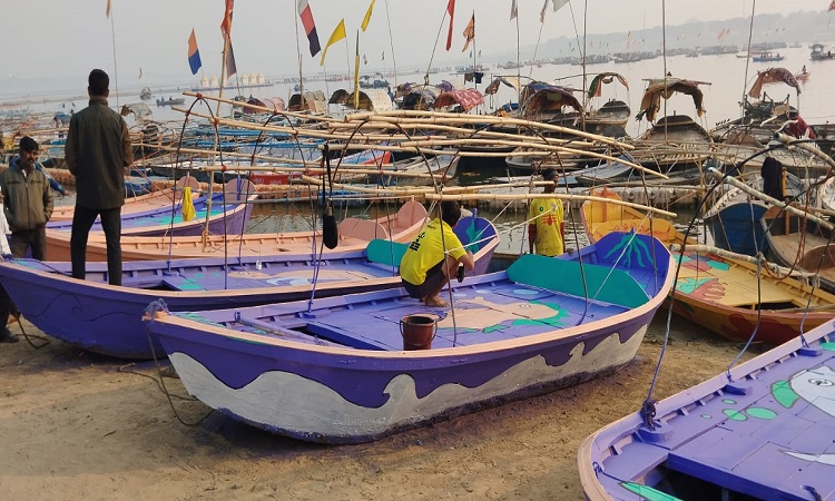 Painting being done on the boats of Sangam